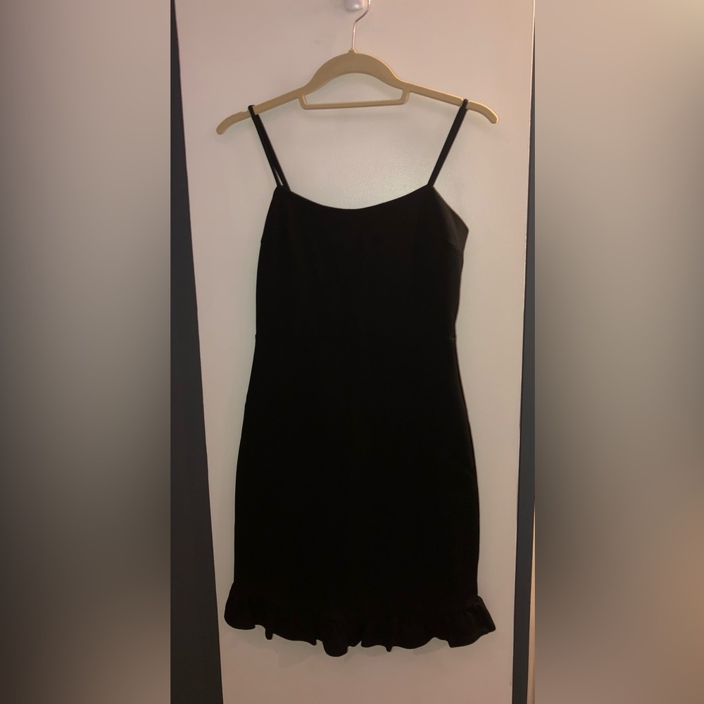 Short black bodycon dress with ruffle trim